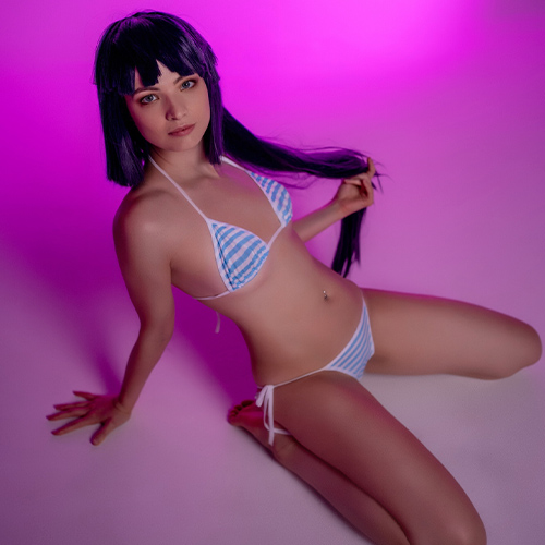 Akatsuki from Log Horizon sits gracefully on the floor, playing with a strand of her long purple hair. Dressed in a blue and white bikini, she is illuminated by a soft pink light that creates a relaxed and dreamy atmosphere.