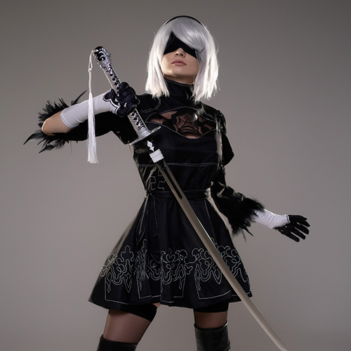 Stunning 2B cosplay from Nier: Automata, featuring a lifelike portrayal of the character in her iconic black dress and wielding a katana. Perfect for fans searching for 2B cosplay inspiration or Nier: Automata cosplay ideas