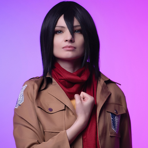 Striking Mikasa Ackerman cosplay from Attack on Titan, showcasing her iconic red scarf and determined expression against a vibrant purple backdrop