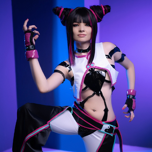 Juri Han cosplay from Street Fighter, striking a fierce pose in her signature outfit with black and pink accents, in a futuristic studio setting with purple and blue lighting