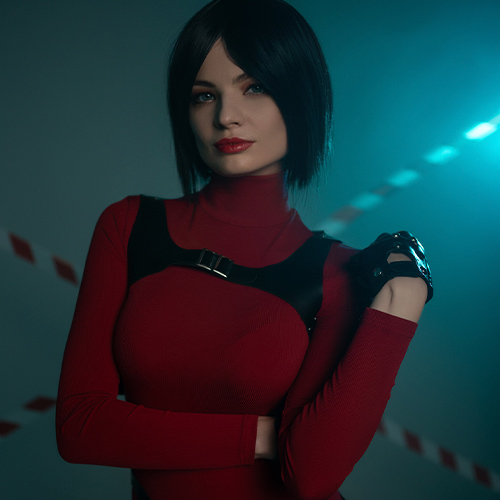 Ada Wong cosplay from Resident Evil showcasing a poised and confident expression, perfectly embodying her iconic mysterious aura. The vibrant red turtleneck dress accentuates her elegance, paired with the tactical harness and gloves that highlight her readiness for action. The softly lit background and subtle caution tape details evoke the intense atmosphere of the Resident Evil universe. This portrayal captures Ada’s blend of sophistication and deadly skill, making it a stunning tribute to one of gaming's most enigmatic characters.