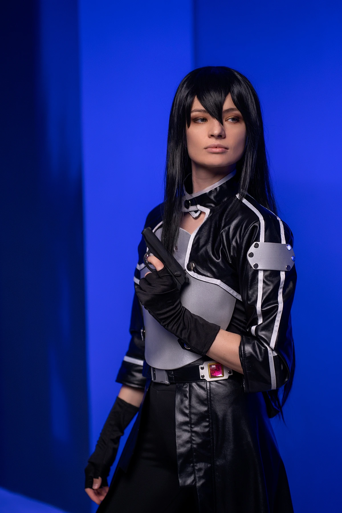 Kirito GGO cosplay side profile pistol blue background