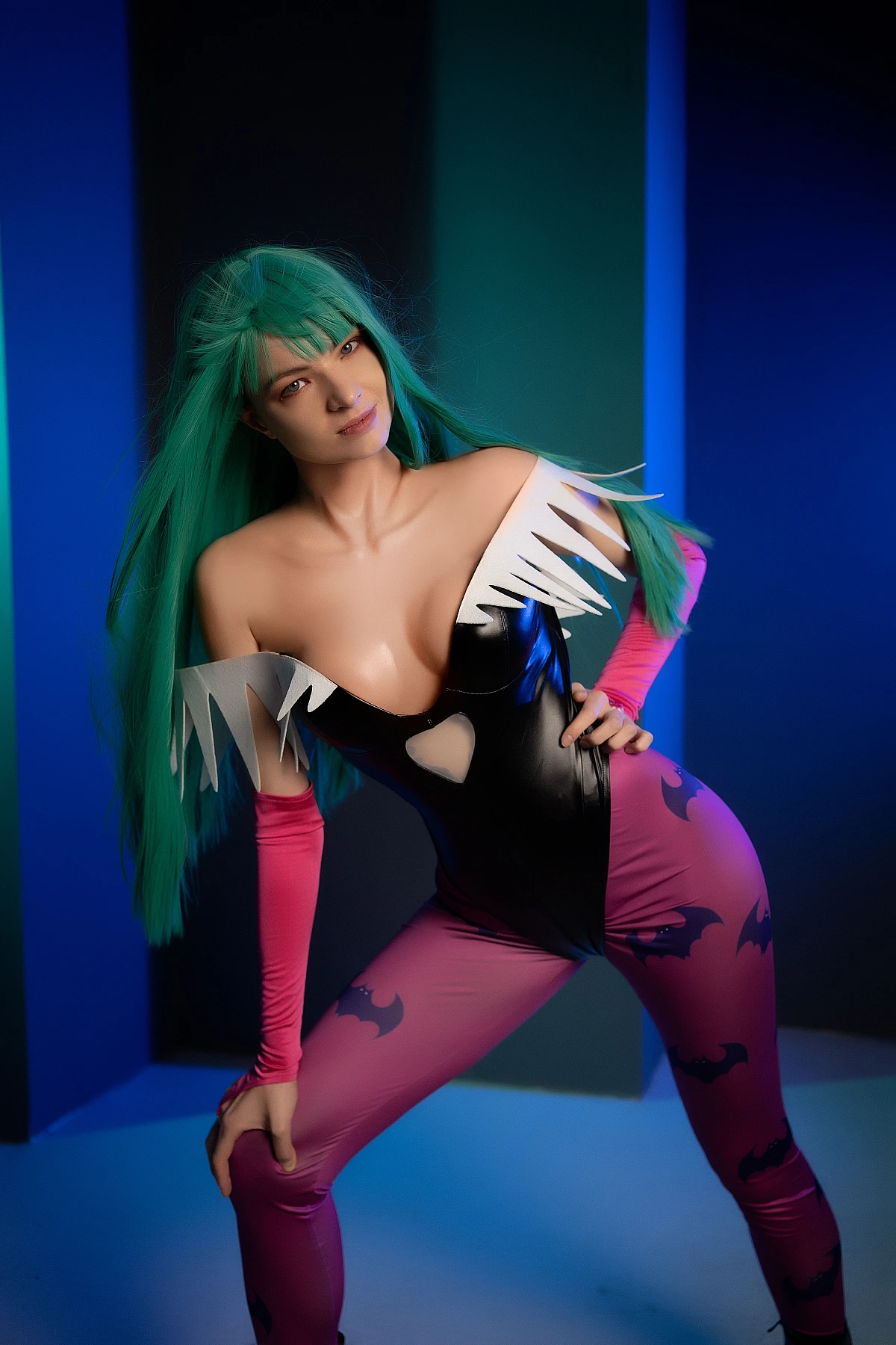 Morrigan Aensland cosplay curved S-pose, cool blue studio panels, glossy bodysuit, green hair, succubus wings