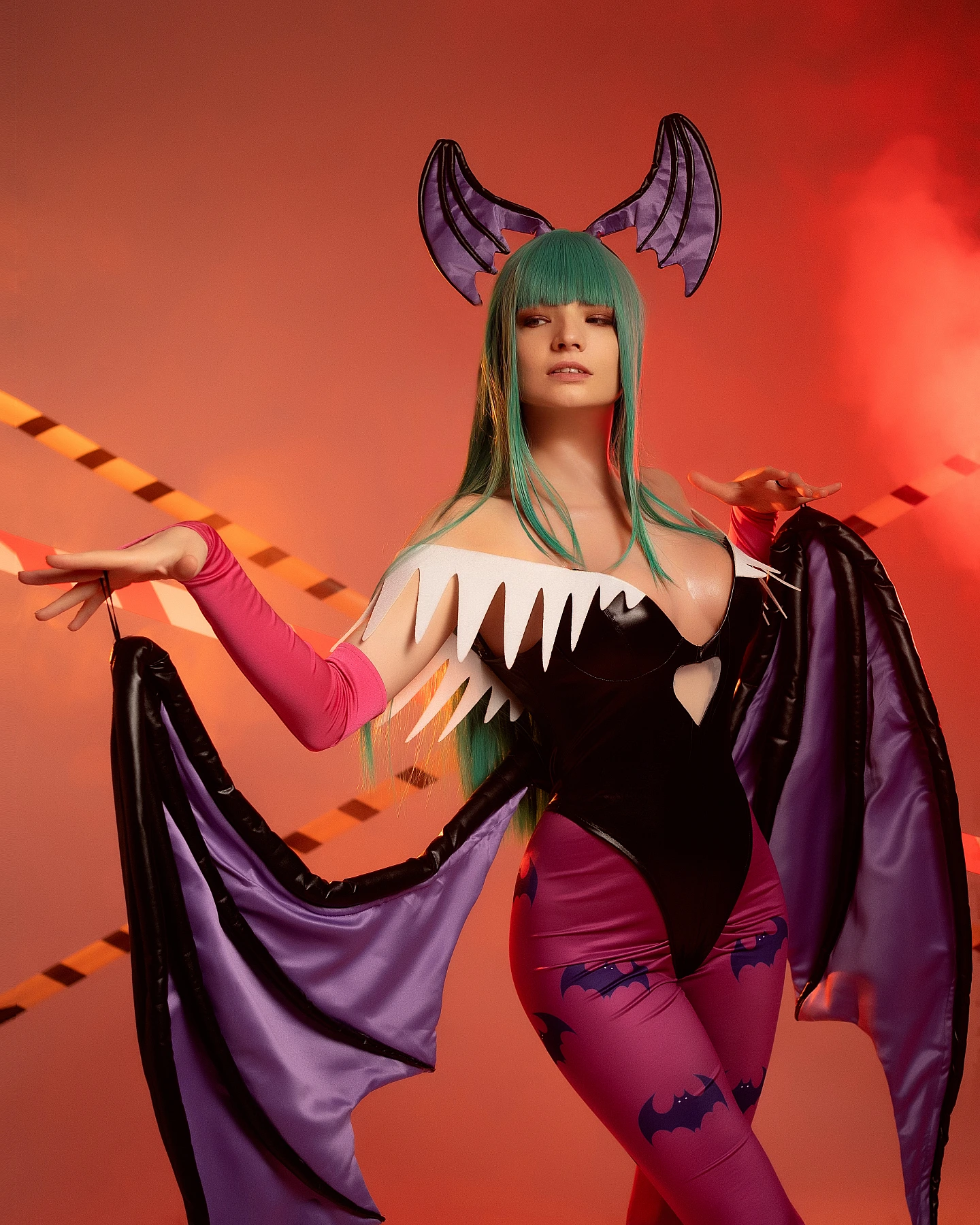 Morrigan Aensland cosplay half-body portrait, extended arms, controlled wing fabric, warm orange lighting, glossy bodysuit