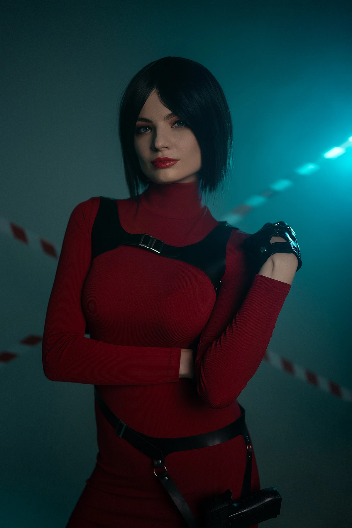 Ada Wong cosplay portrait crossed arms red outfit blue rim light calm confident expression studio