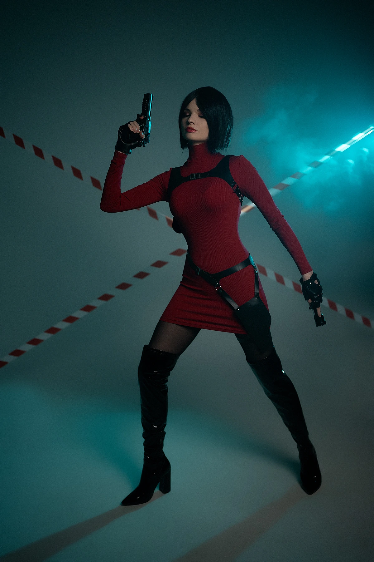 Ada Wong cosplay action stance dual pistols red dress thigh-high boots teal haze smoke dynamic