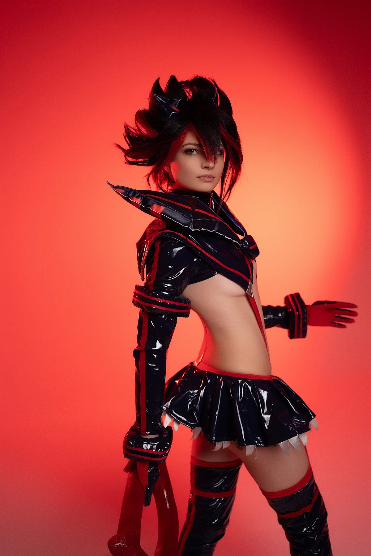 Ryuko Matoi cosplay side profile silhouette crimson red studio lighting glossy Senketsu outfit contour highlights Kill la Kill elegant