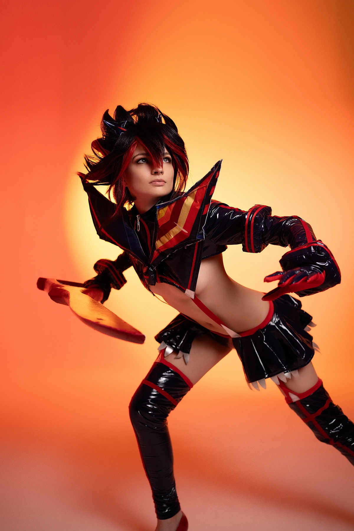 Ryuko Matoi cosplay forward lean action pose low scissor blade fiery orange studio gradient glossy Senketsu tension Kill la Kill final