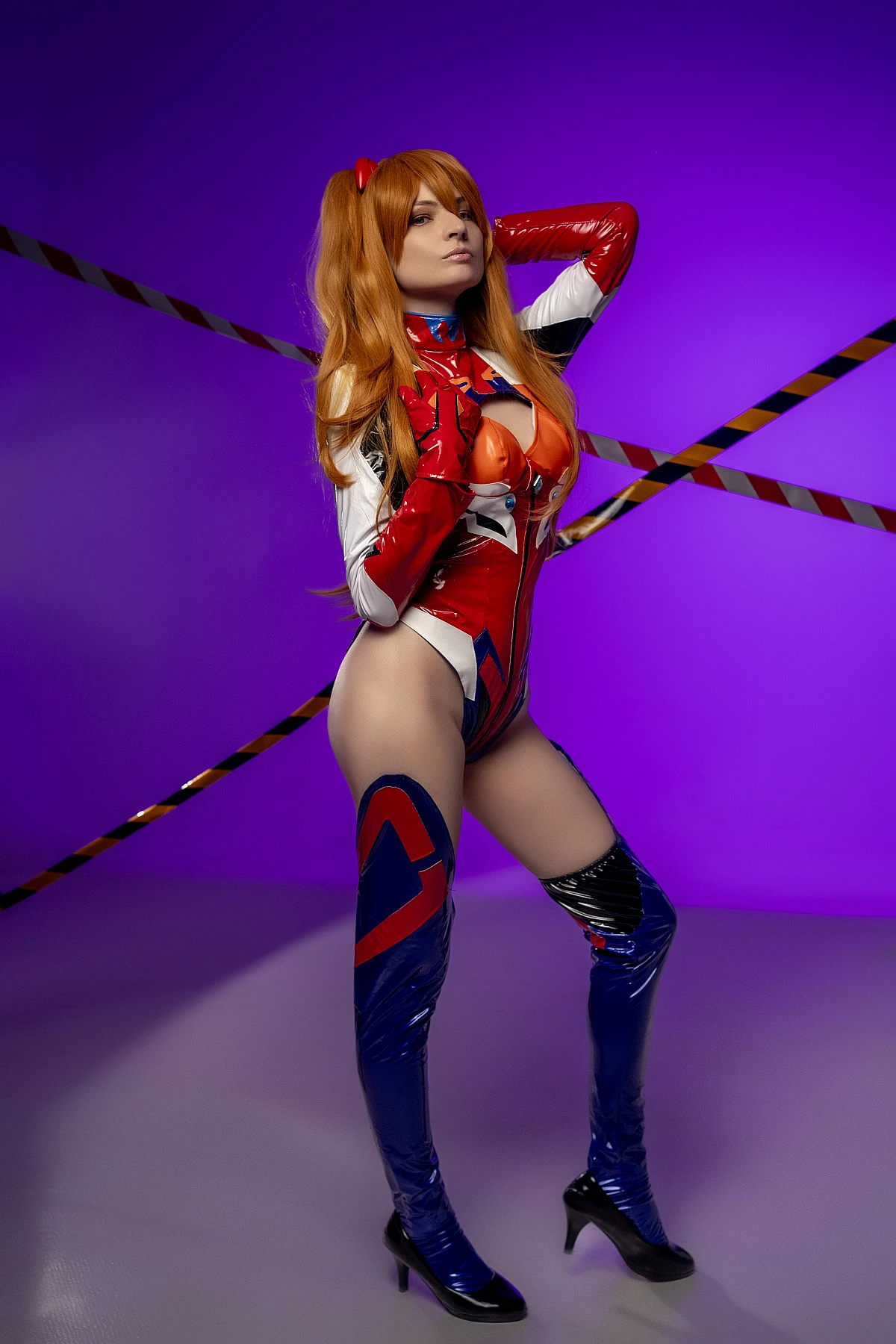 Asuka elegant standing pose cosplay in latex plugsuit with thigh-high boots