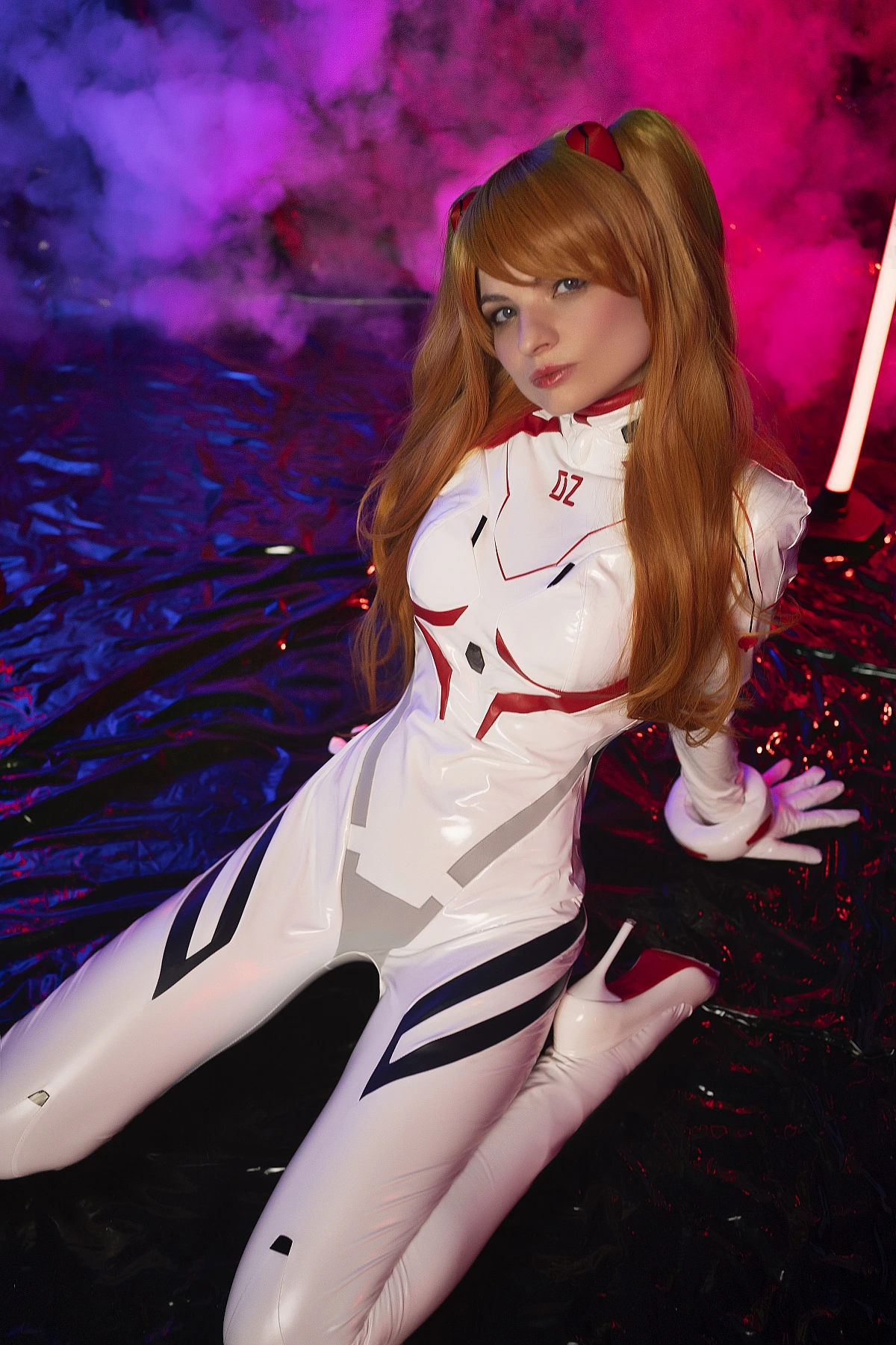 Asuka Langley Cosplay — White Rebuild Plugsuit Semi-Reclined Floor Pose, Arm Propped Behind, Intense Direct Eye Contact, Pink Magenta Smoke Background