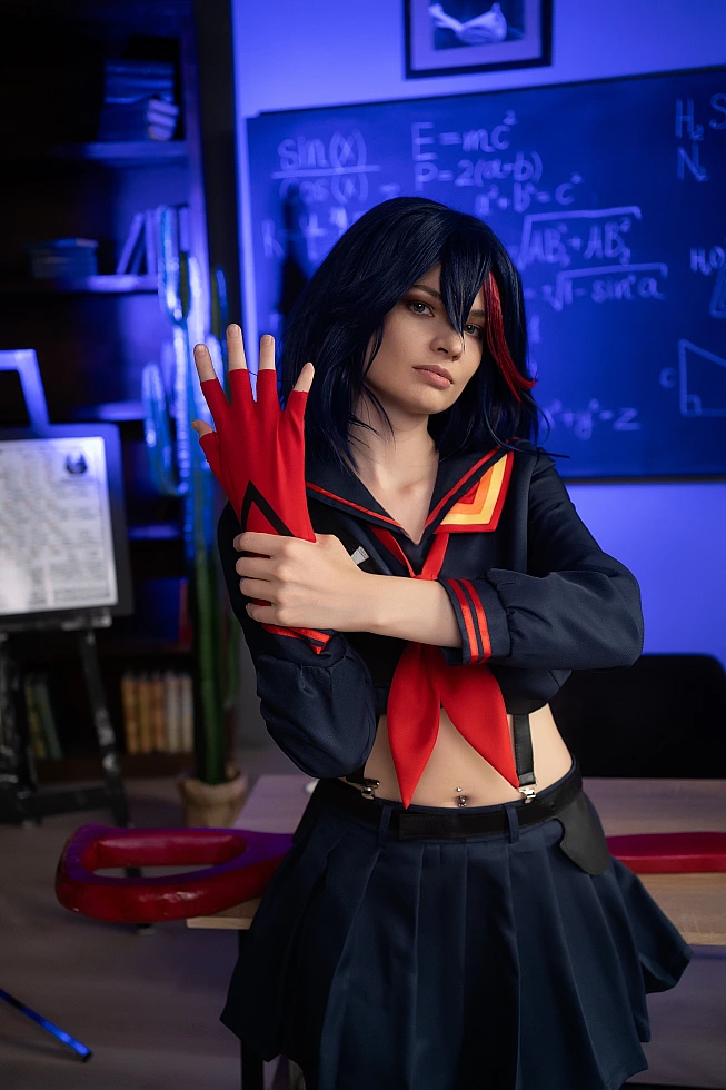 Ryuko Matoi cosplay close-up portrait with crimson hair streak in cool blue light