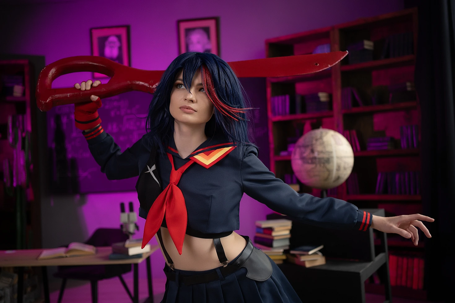 Ryuko Matoi cosplay with scissor blade on shoulder in magenta-violet neon lighting