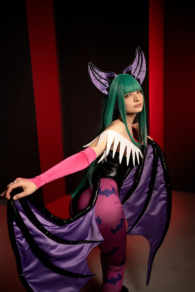 Morrigan Aensland cosplay over-the-shoulder gaze, purple wing fabric, dark background, red accent lights, glossy bodysuit