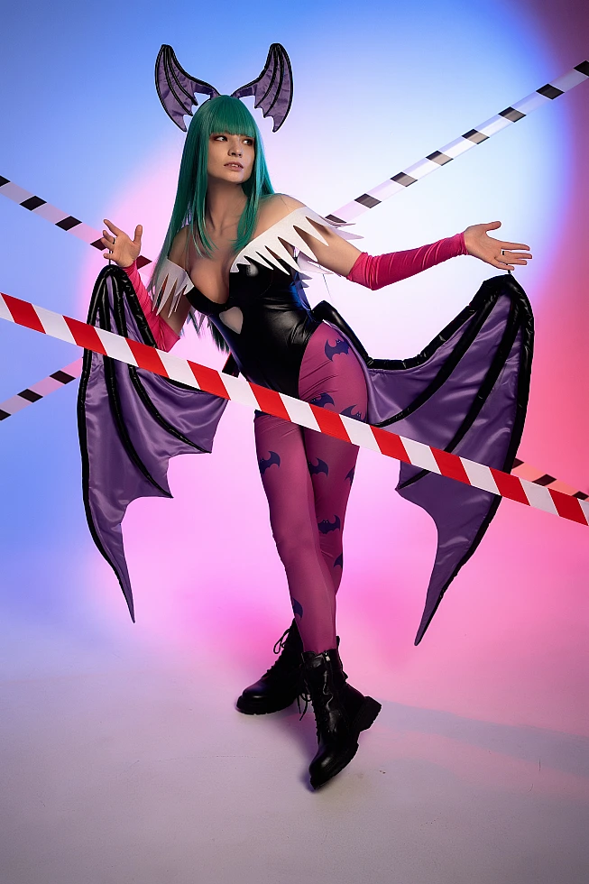 Full body Morrigan Aensland cosplay, diagonal tape lines, open wings, neon blue-pink studio lighting, green hair
