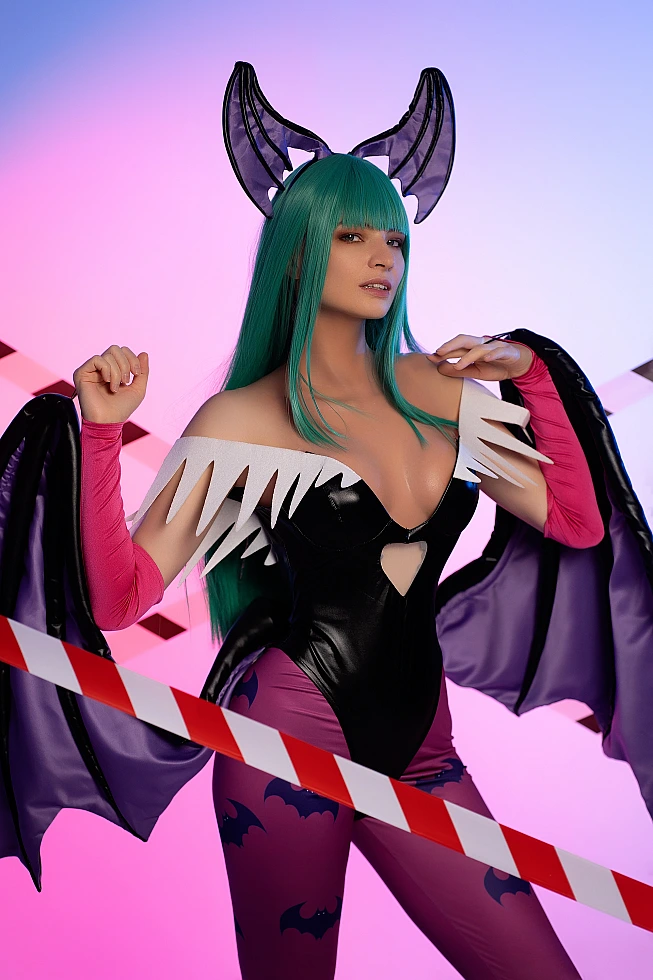 Morrigan Aensland cosplay upper-body portrait, pastel neon blue-pink lighting, shoulders, glossy bodysuit, wing texture