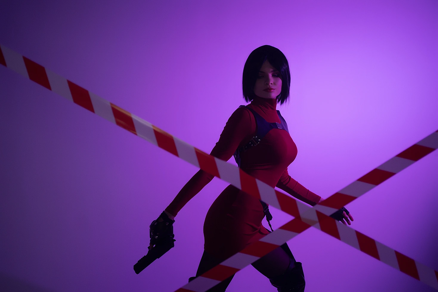 Ada Wong cosplay silhouette purple neon light red outfit pistol low crossed tape lines graphic