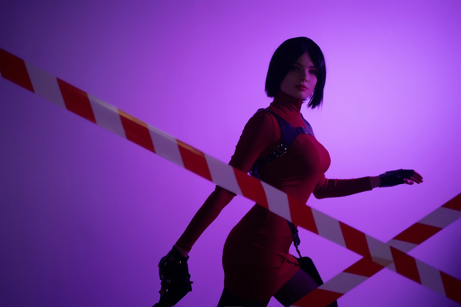 Ada Wong cosplay motion pose purple light red dress low weapon diagonal tape lines graphic