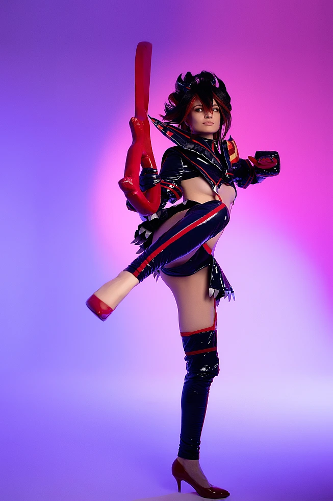 Ryuko Matoi cosplay high kick frozen pose violet pink studio lighting glossy Senketsu outfit scissor blade counterbalance Kill la Kill