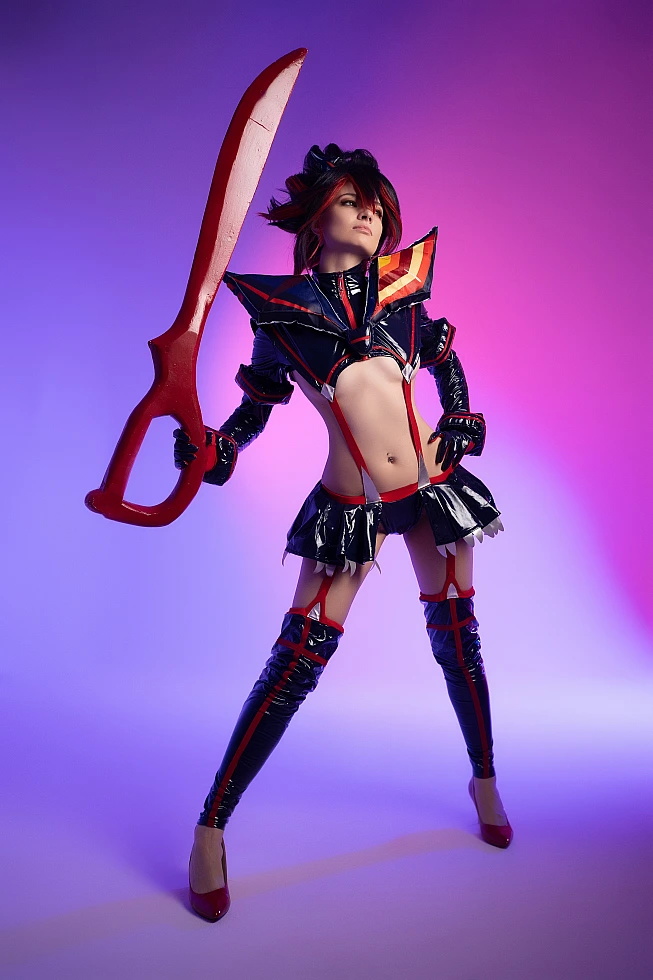 Ryuko Matoi cosplay wide power stance vertical scissor blade neon violet pink studio background glossy Senketsu contours Kill la Kill