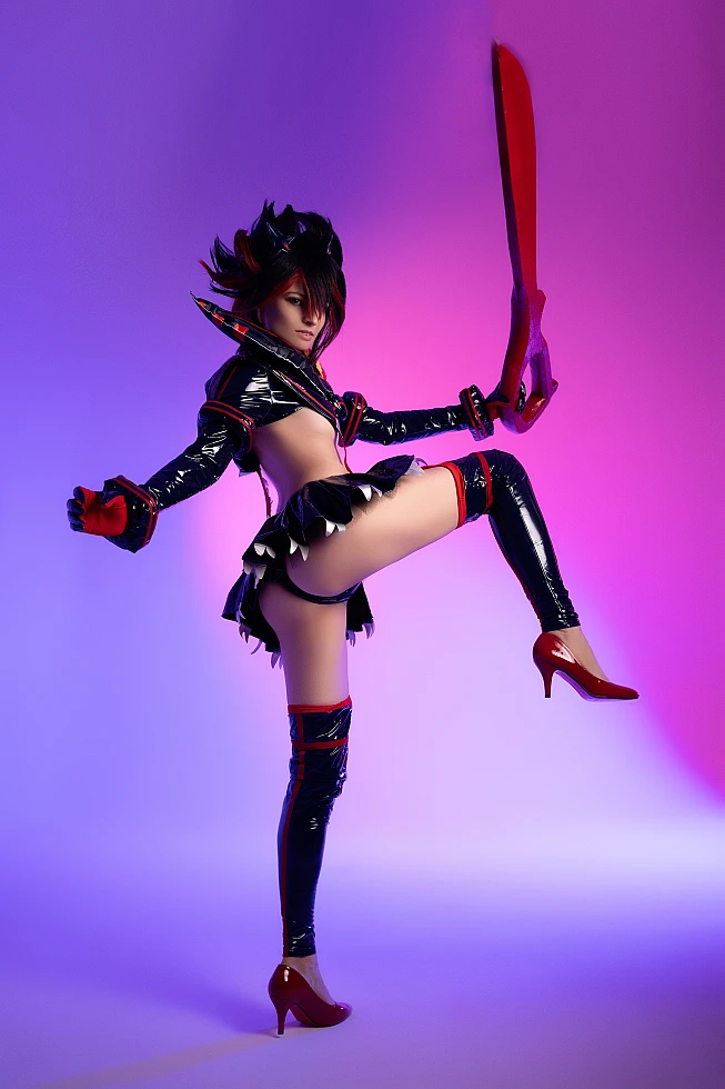 Ryuko Matoi cosplay balanced one leg pose raised vertical scissor blade neon violet pink studio background Senketsu Kill la Kill