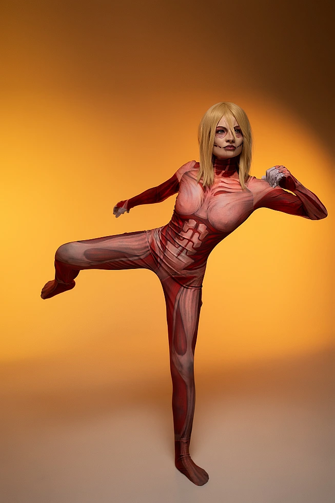 Female Titan cosplay balanced kick pose, Annie Leonhart, anatomical muscle bodysuit, warm background AOT cosplay