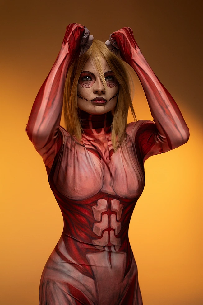 Female Titan cosplay raised arms portrait, Annie Leonhart, warm gradient lighting, titan makeup, AOT cosplay