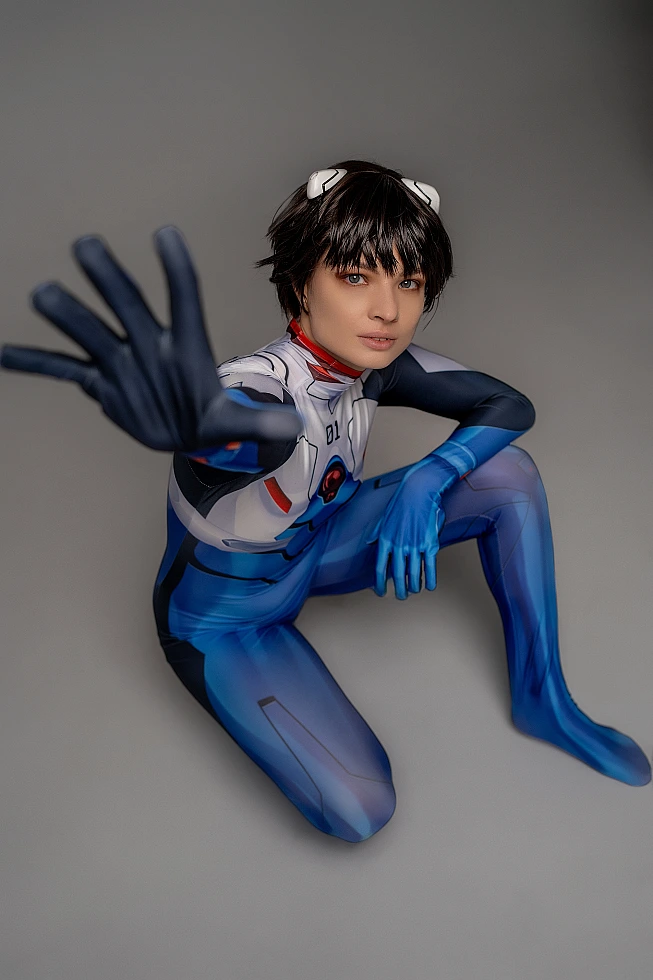 trap femboy Shinji Ikari cosplay, glossy blue bodysuit, white horn clips, kneeling reaching pose, anime trap photography