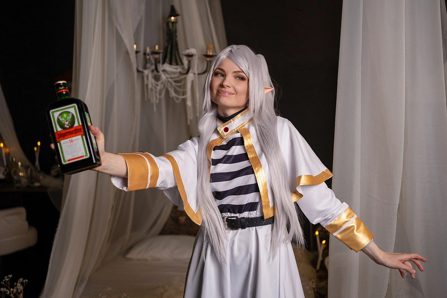 Frieren meme cosplay - funny elf mage holding Jagermeister bottle from Sousou no Frieren