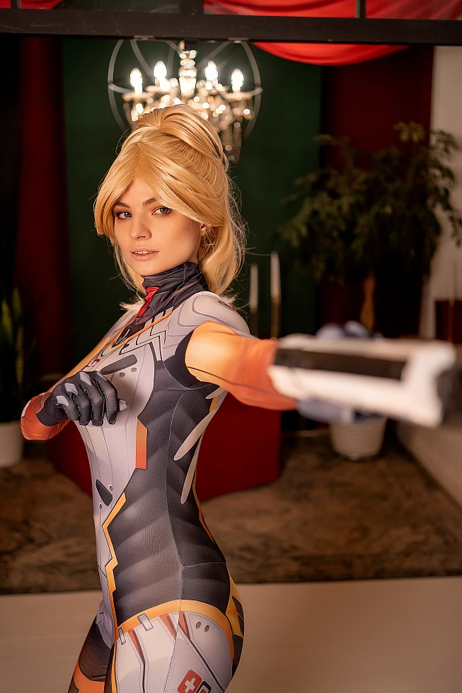 Mercy Overwatch cosplay aiming blaster forward, shallow depth of field with chandelier bokeh, detailed medical bodysuit