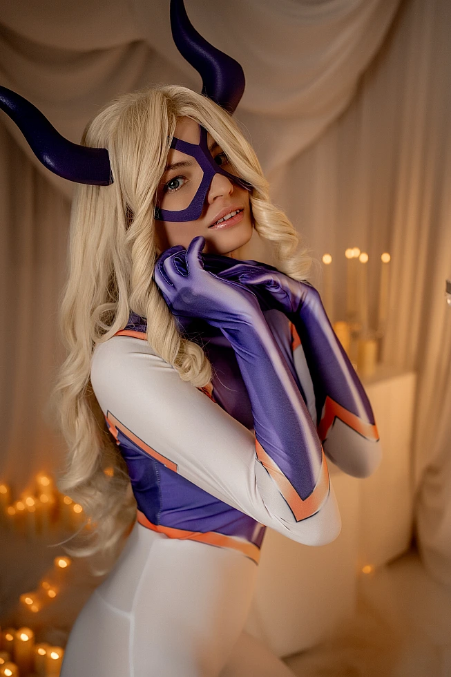 Mt. Lady cosplay intimate portrait with hands near face, horned mask and warm studio lighting