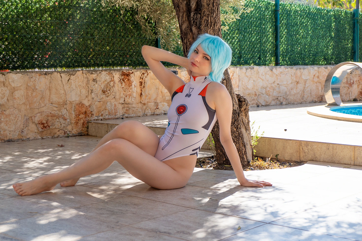 Rei Ayanami cosplay stone floor hand behind head relaxed white plugsuit outdoor light Evangelion character portrait