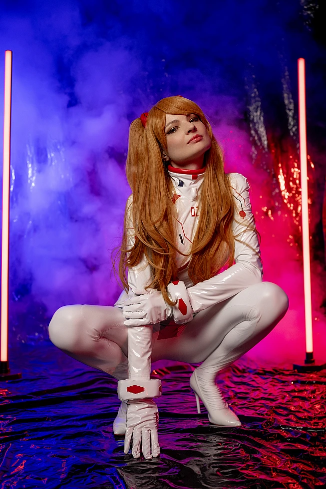 Asuka Langley Cosplay — White Rebuild Plugsuit Deep Crouch Pose, Hands on Boot, Arrogant Upward Gaze, Blue Purple Neon Smoke Studio