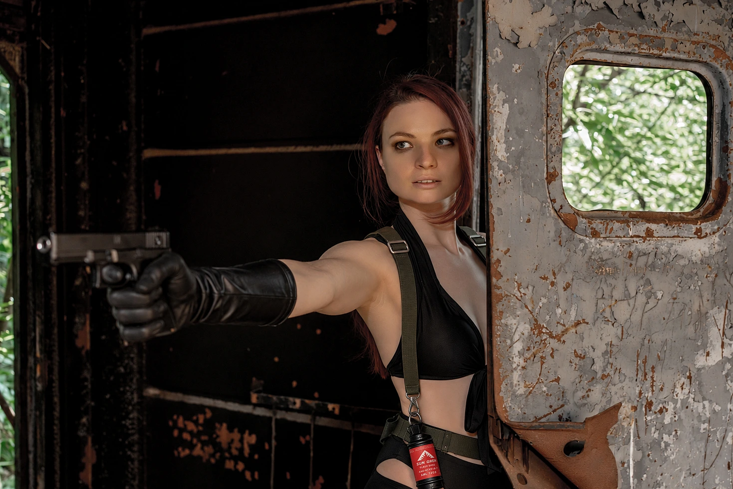 Quiet cosplay from Metal Gear Solid V aiming a handgun from the open door of an abandoned train car